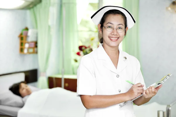 Friendly doctor with patient — Stock Photo, Image