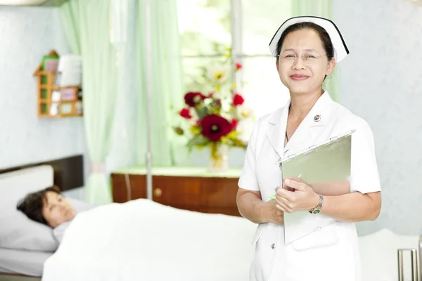 Friendly doctor with patient — Stock Photo, Image