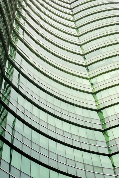 Modern green glass skyscraper perspective view — Stock Photo, Image