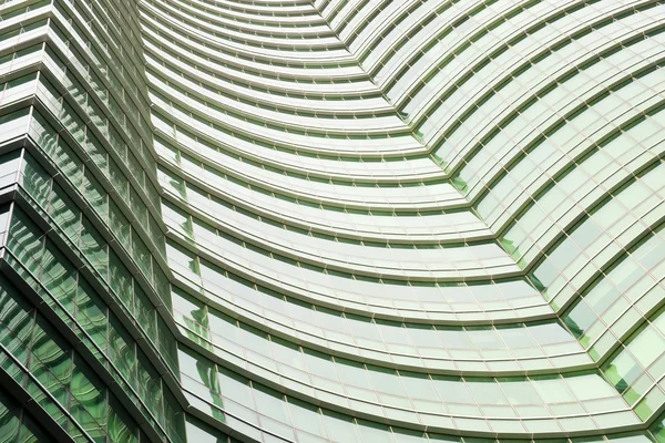 Modern green glass skyscraper perspective view — Stock Photo, Image