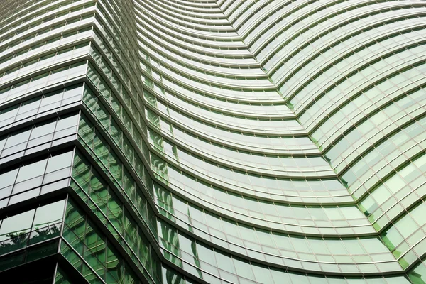 Modern green glass skyscraper perspective view — Stock Photo, Image