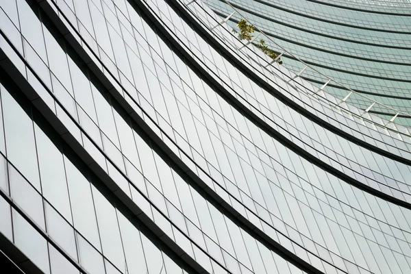 Modern green glass skyscraper perspective view — Stock Photo, Image