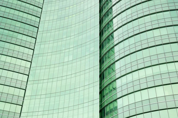 Modern green glass skyscraper perspective view — Stock Photo, Image