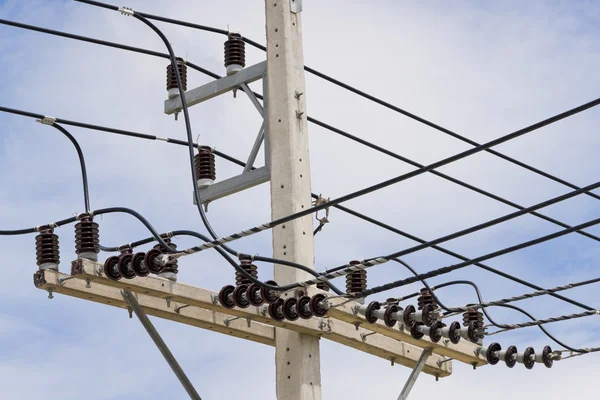 Power lines on the blue sky with cloudy background — Stock Photo, Image