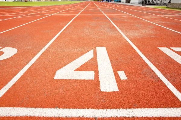 Tracks on red field .four — Stock Photo, Image