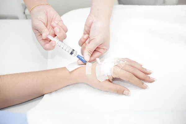 Injection in hand — Stock Photo, Image