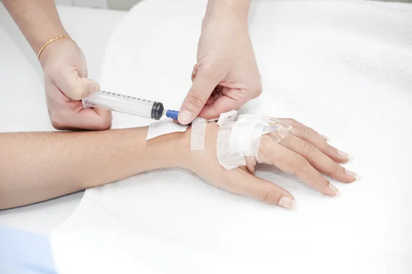 Injection in hand — Stock Photo, Image