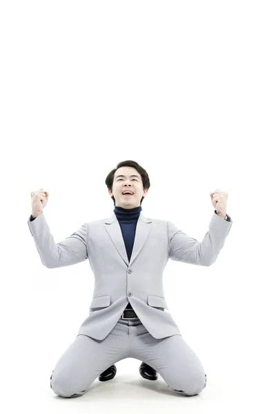 Successful businessman celebrating with arms up - isolated over a white background — Stock Photo, Image