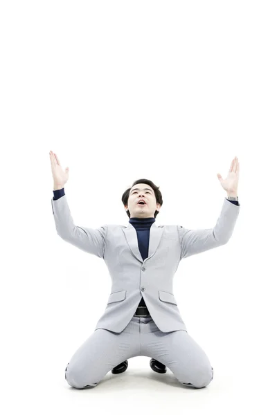 Successful businessman celebrating with arms up - isolated over a white background — Stock Photo, Image