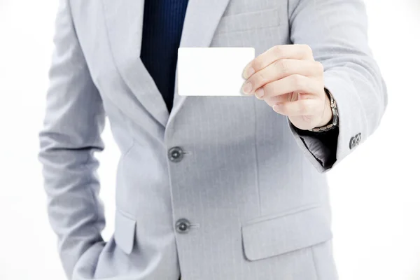 Businessman's hand holding blank paper business card — Stock Photo, Image