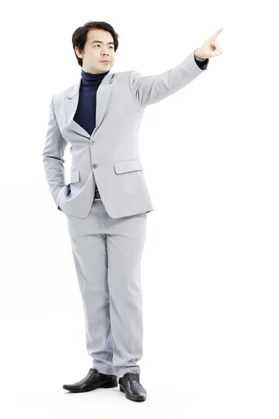 Businessman pointing at his future on white background — Stock Photo, Image
