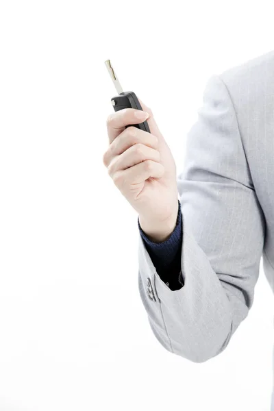 Concept image of a businessman holding a key — Stock Photo, Image