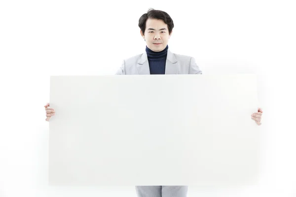 Ung mann med blank plakat – stockfoto