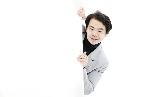 Young man holding blank billboard — Stock Photo, Image