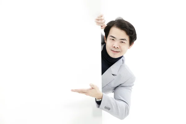 Young man holding blank billboard — Stock Photo, Image