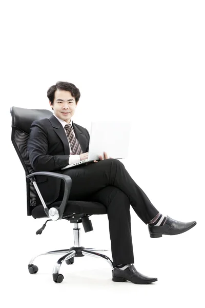 Portrait of handsome young business man using new laptop — Stock Photo, Image