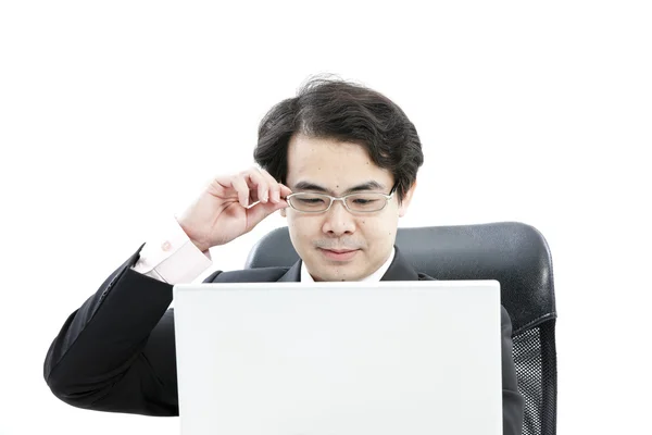 Portrait of handsome young business man using new laptop — Stock Photo, Image