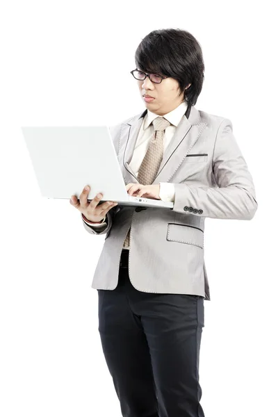 Businessman holding on his computer — Stock Photo, Image