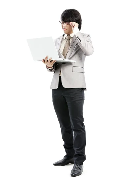 Businessman holding on his computer — Stock Photo, Image