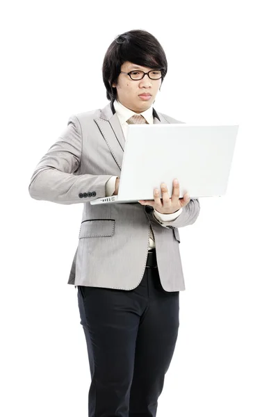 Businessman holding on his computer — Stock Photo, Image