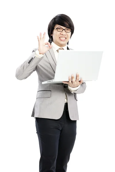 Empresário segurando em seu computador — Fotografia de Stock