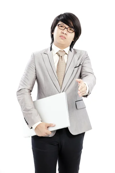 Businessman holding on his computer — Stock Photo, Image