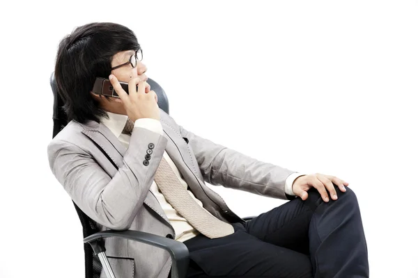 Businessman making a phone call against a white background — Stock Photo, Image