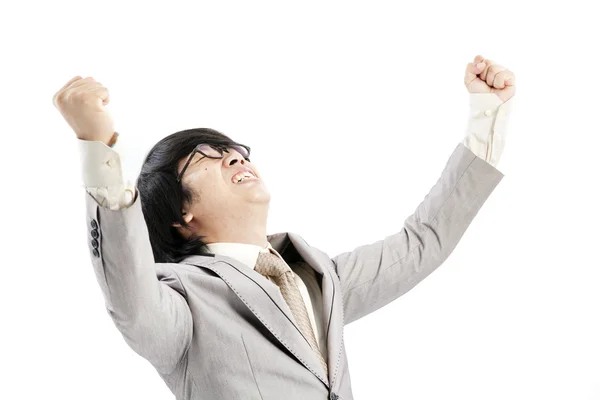 Successful businessman celebrating with arms up - isolated over a white background — Stock Photo, Image