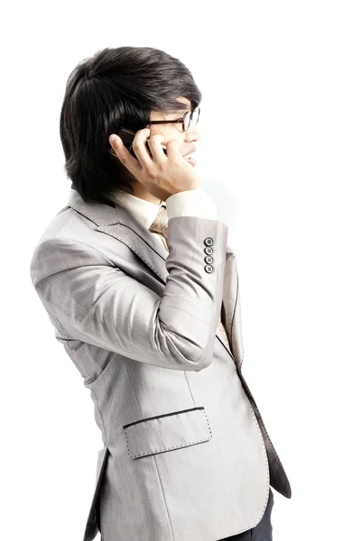 Businessman making a phone call against a white background — Stock Photo, Image