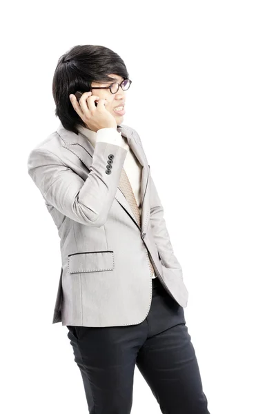 Businessman making a phone call against a white background — Stock Photo, Image