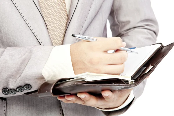 Businessman writing in office — Stok fotoğraf