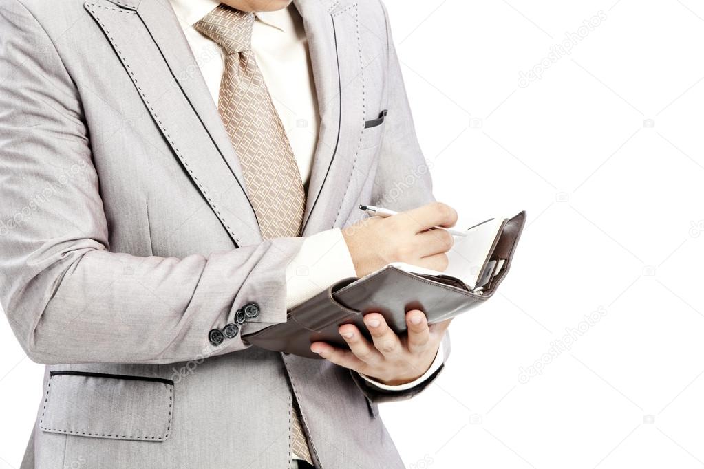 Businessman writing in office