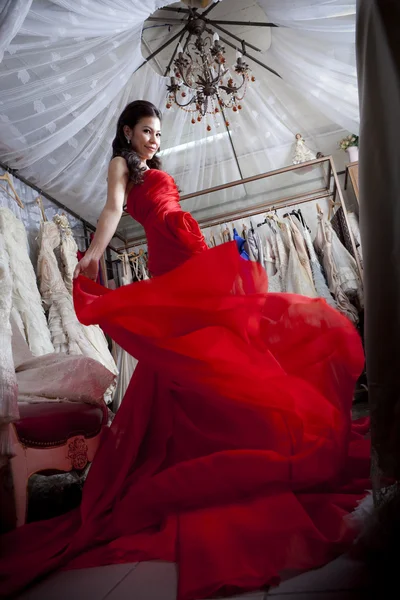 Beautiful asian woman in luxury red dress — Stock Photo, Image