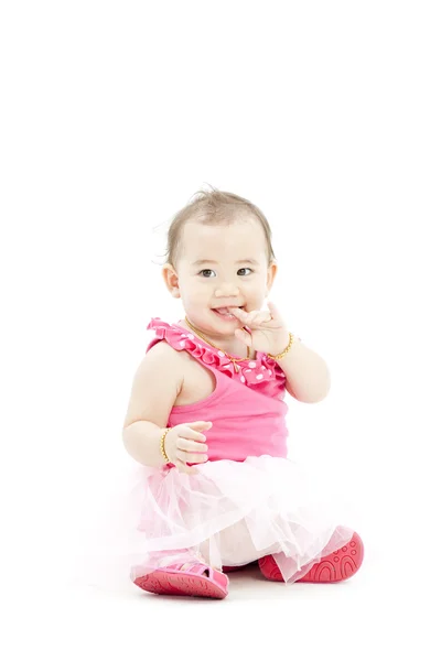 Schattige babymeisje in roze kleding — Stockfoto