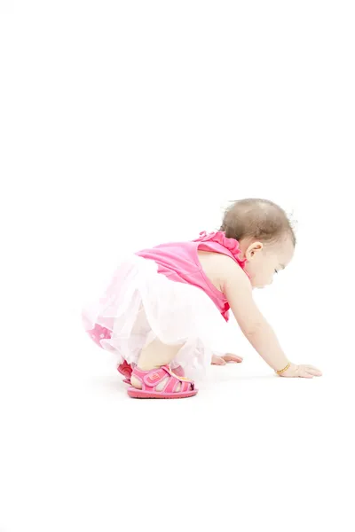 Cute baby girl in pink clothes — Stock Photo, Image