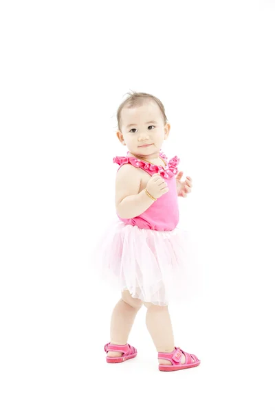 Schattige babymeisje in roze kleding — Stockfoto