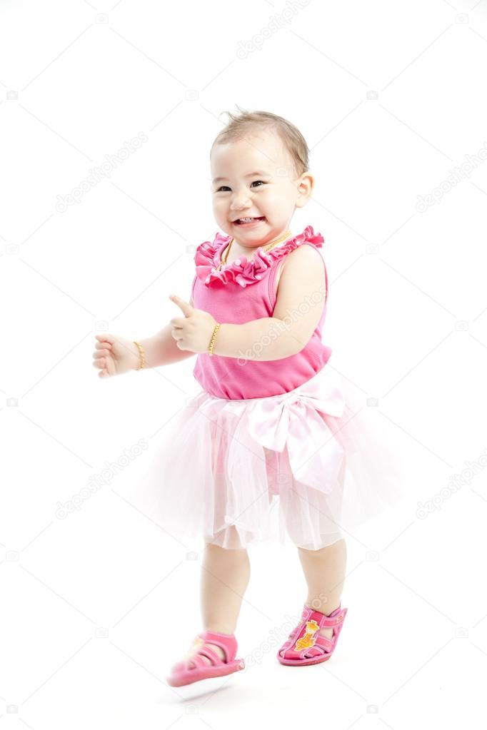 Cute baby girl in pink clothes