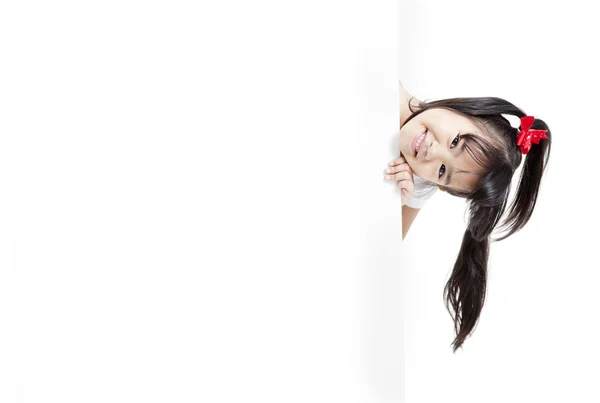 Young Asian girl holding a blank white card. — Stock Photo, Image