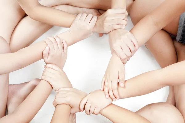 Asian children's hands circle on a white background — Stock Photo, Image