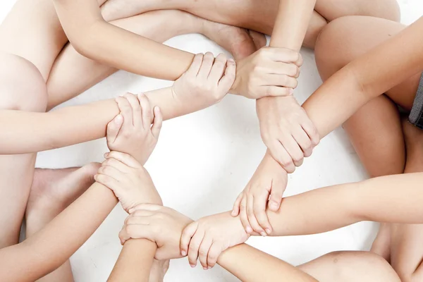Asian children's hands circle on a white background — Stock Photo, Image