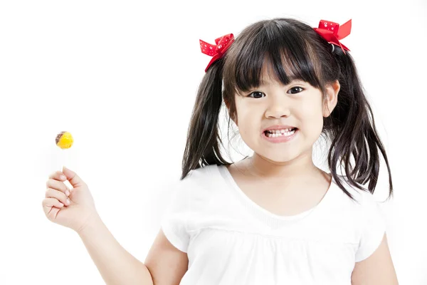 Poco lindo divertido chica asiática con colorido caramelo piruleta —  Fotos de Stock