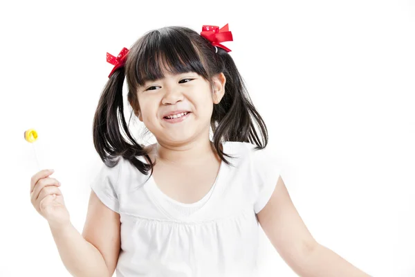 Little cute funny asian girl with colorful lollipop candy — Stock Photo, Image