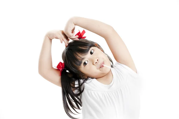 Little cute funny asian girl with colorful lollipop candy — Stock Photo, Image