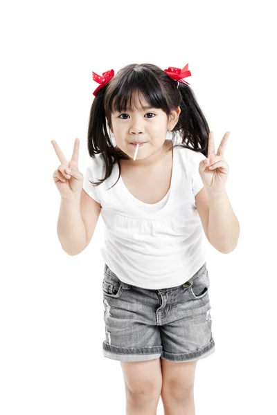 Little cute funny asian girl with colorful lollipop candy — Stock Photo, Image