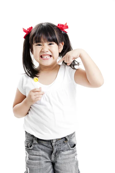 Little cute funny asian girl with colorful lollipop candy — Stock Photo, Image