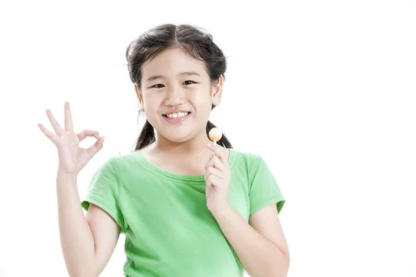 Little cute funny asian girl with colorful lollipop candy Stock Image