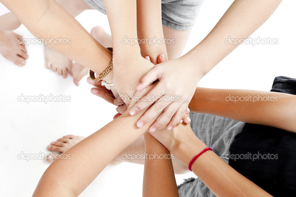 Asian children's hands together on a white background