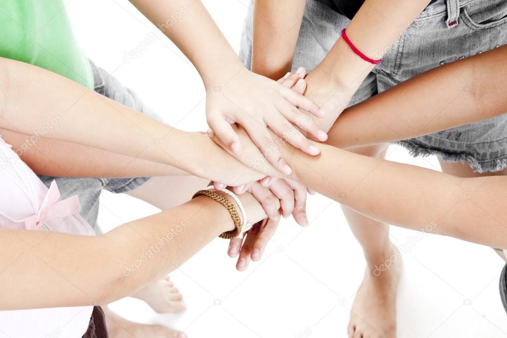Asian children's hands together on a white background