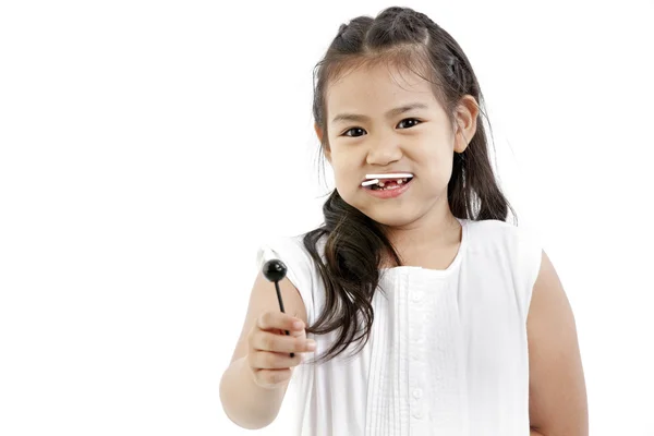 Hermosa niña con piruleta — Foto de Stock