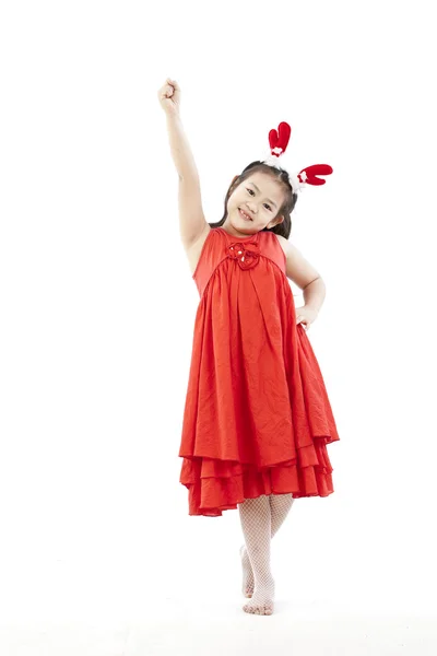 Portret van gelukkig meisje in santa jurk — Stockfoto